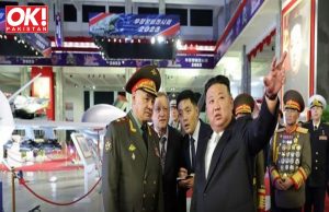 KIM DEMONSTRATES ILLEGAL MISSILES TO A RUSSIAN GOVERNMENT OFFICIAL.